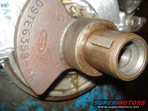 Close-up of a rusty Ford part with D9TE6559-AA stamped on it