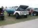 1994 Ford Bronco - This lifted Ford F-Series truck, likely from the late 1970s, is displayed with its hood open at an outdoor event.