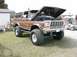 1994 Ford Bronco - This lifted 1978 Ford Bronco is displayed with its hood open, revealing the engine compartment.