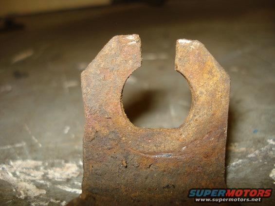 Rusted metal brake part with a circular cutout