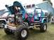 1994 Ford Bronco - Customized Jeep CJ with a highly modified engine and unique paint scheme on display.