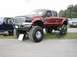 1994 Ford Bronco - This lifted pickup truck appears to be from the mid-2000s, not a 1994 model.