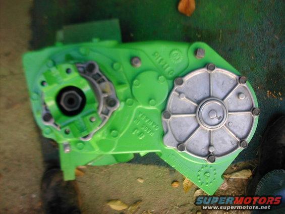 green transfer case with silver cover, made in Canada stamped on it