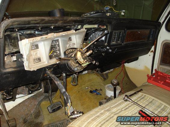 1979 Ford Bronco interior dashboard with gauges and steering column disassembled