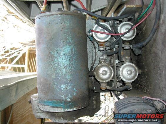 Winch motor and solenoids with visible wiring and metal casing