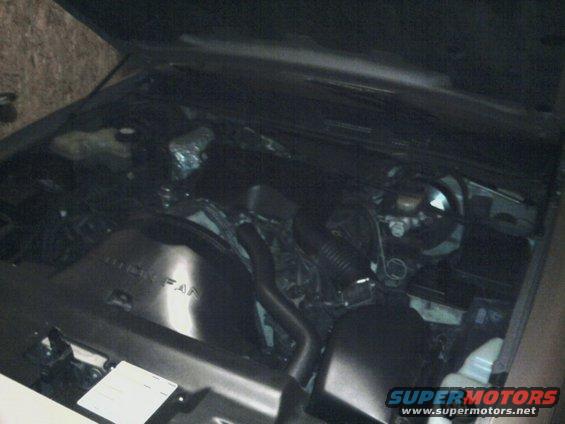 1996 Mercury Grand Marquis engine bay with hood open, showing fan shroud and engine components