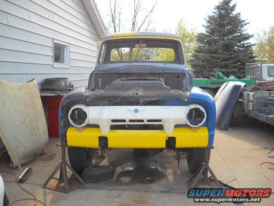 54-build--41910-061.jpg Next I bolted in the front valance and then bolted in the grille. The truck now has it's fangs! :lol: 