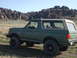 1989 Ford Bronco - This 1987 Ford Bronco is shown in a dry, rocky landscape under a clear blue sky.