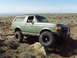 1989 Ford Bronco - This 1989 Ford Bronco navigates a rocky, off-road path under a clear sky.
