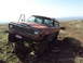 1989 Ford Bronco - This Jeep Wagoneer navigates a rocky trail with its driver's door ajar.