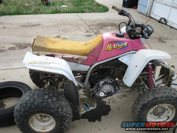 Pink and white ATV with 'Blaster' text visible