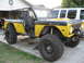 1973 Ford Bronco - This modified 1973 Ford Bronco features a roll cage and large off-road tires, ready for adventure.