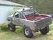 1985 Toyota Pickup/SR5 - This modified 1985 Toyota Pickup SR5 features a lifted suspension and a roll bar.