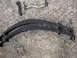 1979 Ford F-250 - Various truck suspension and steering components laid out on a concrete surface.