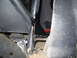 1984 Ford Bronco II - Close-up view of a heavily modified vehicle frame, showing custom metalwork and suspension components.