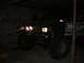 1984 Ford Bronco II - This modified SUV sits in a garage, its large tires and brush guard suggesting off-road use.