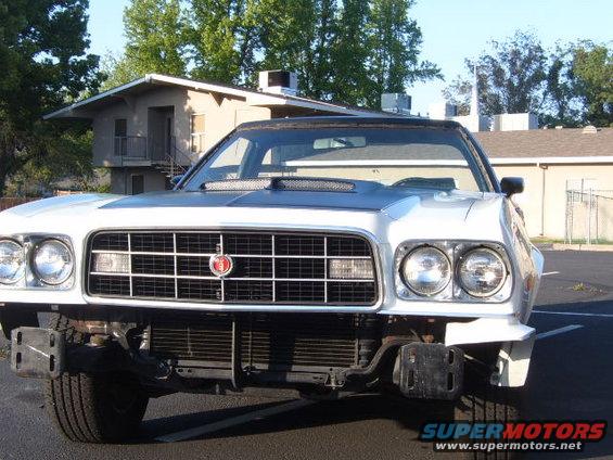 1972 Ford Ranchero front end with a black hood scoop and a damaged bumper