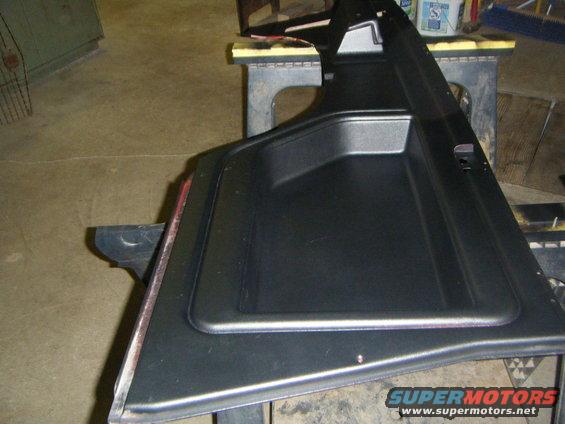 Black interior door panel with storage pocket
