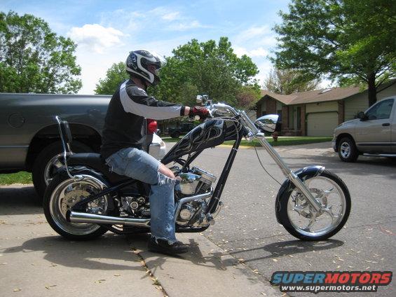 Custom chopper motorcycle with flame paint on fuel tank