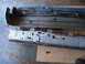 1973 Ford Ranchero - Disassembled car bumper assembly, showing inner reinforcement and outer cover.