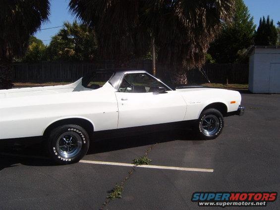 White 1973 Ford Ranchero side view with black trim and aftermarket wheels