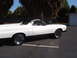 1973 Ford Ranchero - Side profile of a white 1973 Ford Ranchero pickup truck parked outdoors on a sunny day.