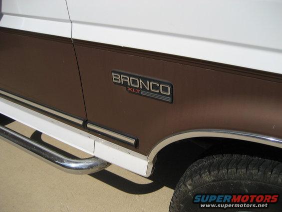 1993 Ford Bronco XLT side emblem on brown and white body