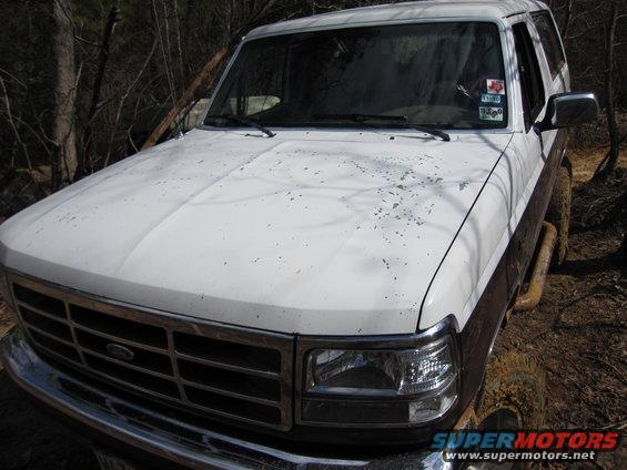 1993 Ford Bronco, white and brown, 3q-front view. Windshield sticker visible