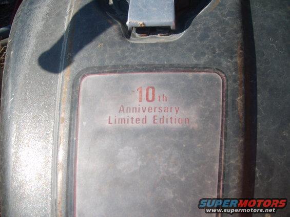 Motorcycle fuel tank emblem reading "10th Anniversary Limited Edition"