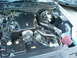 2003 Ford Crown Victoria - Engine bay of a 2003 Ford Crown Victoria, showing the V8 engine and air intake system.
