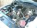 2003 Ford Crown Victoria - Engine bay of a 2003 Ford Crown Victoria, showing the V8 engine and intake system.