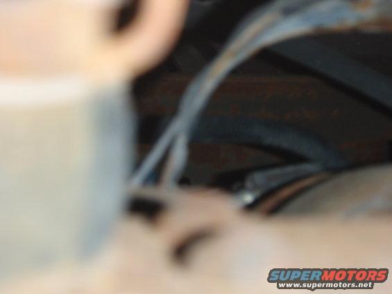 Close-up of rear suspension components with wiring