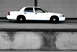 1998 Ford Crown Victoria - Side profile of a white sedan with black wheels.