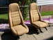 1979 Jeep CJ7 - Pair of tan bucket seats, possibly from an older vehicle, displayed outside.