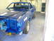 1978 Ford Ranchero - Ford Ranchero in a paint booth, missing headlights and bumper, being prepped for new paint.