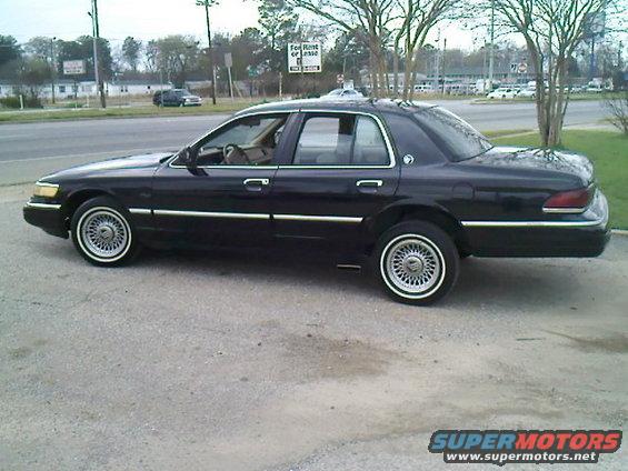 1merc.jpg when i first got it, lifted the rear end and piped it