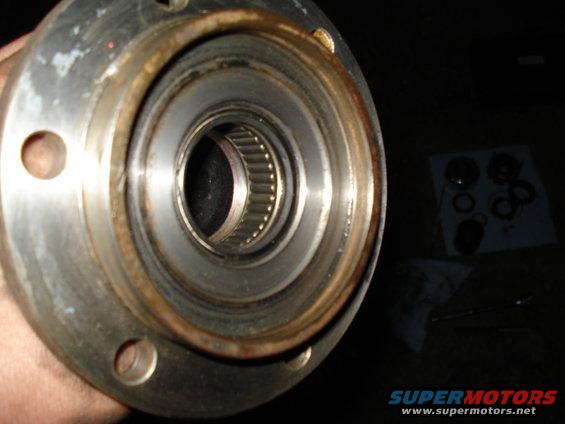 Close-up of a vehicle's wheel bearing and hub assembly, showing the inner workings of the bearing