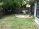 1983 Ford 427 - A typical suburban backyard scene a dog house and patio area.