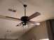 1983 Ford 427 - A ceiling fan with four dark wood blades and three glass light fixtures is visible against a textured ceiling.