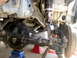 1996 Ford Bronco - Modified front suspension components are visible, including a large differential and shock absorber assembly.