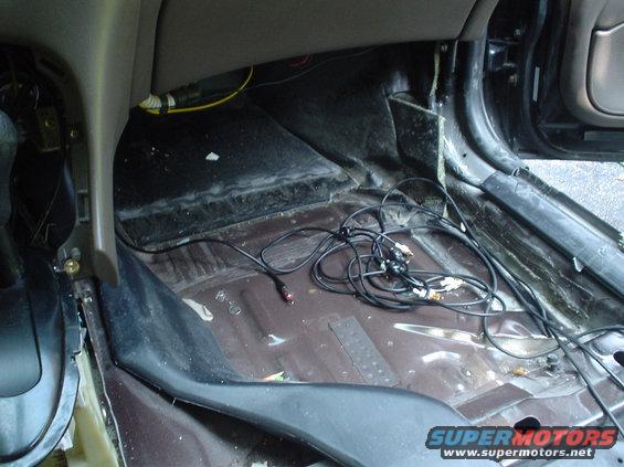 dsc00486.jpg Picture of the passengers footwell from the dead center of the car looking forward. The cables there are the rca's for my future radio mod.