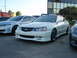 2003 Acura TL - White 2003 Acura TL sedan with roof rack and aftermarket wheels.