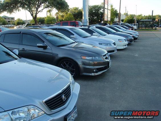 Gray 2003 Acura TL sedan parked in a line of cars