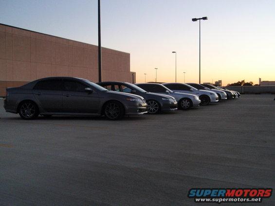 Gray 2004 Acura TL sedan parked in a lot, side view