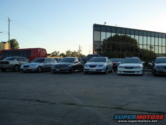 Several Acura sedans parked in a lot, one is a 2004 model