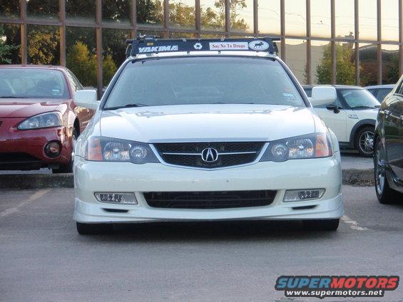 White 2003 Acura TL with a Yakima roof rack and a "Say No To Drugs" sticker