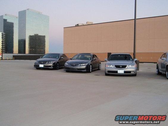Front view of a 2003 Acura TL in a parking lot with other cars
