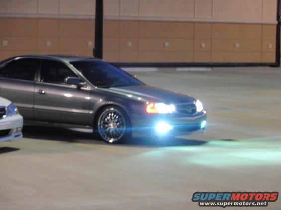 Gray 2003 Acura TL with aftermarket wheels and bright headlights