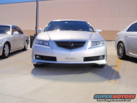 Silver Acura sedan front view with grille and headlights visible