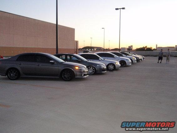Gray 2003 Acura TL parked in a row of cars at dusk